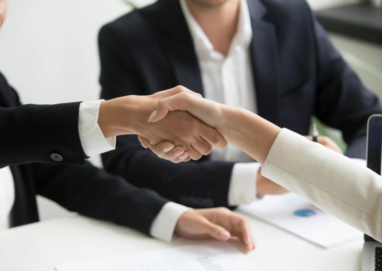 Onestream handshake people in business suit