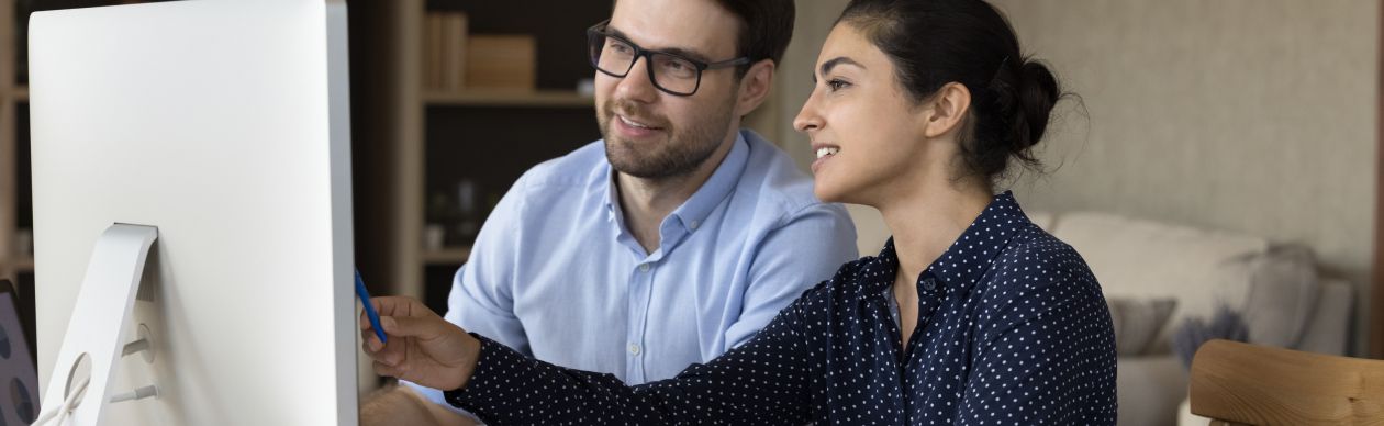 CX experts researching AI innovations at Gladly at their office computer