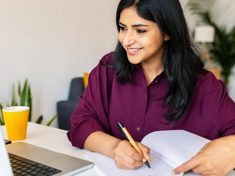 CX leader working on her laptop