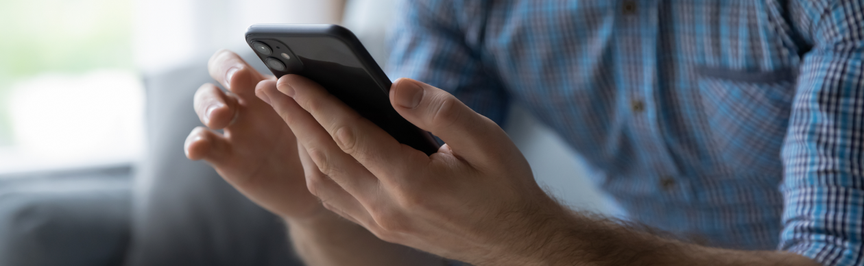 Someone typing on their smartphone
