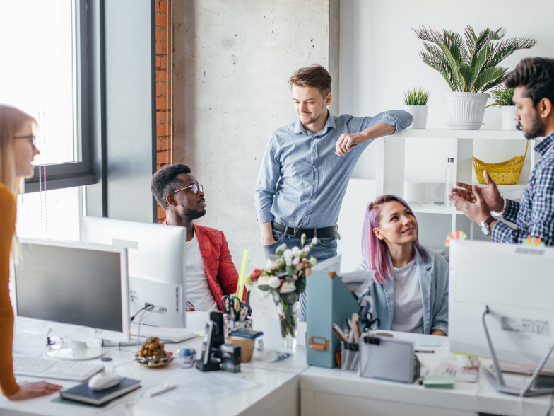 Small team of professionals discussing business in an office