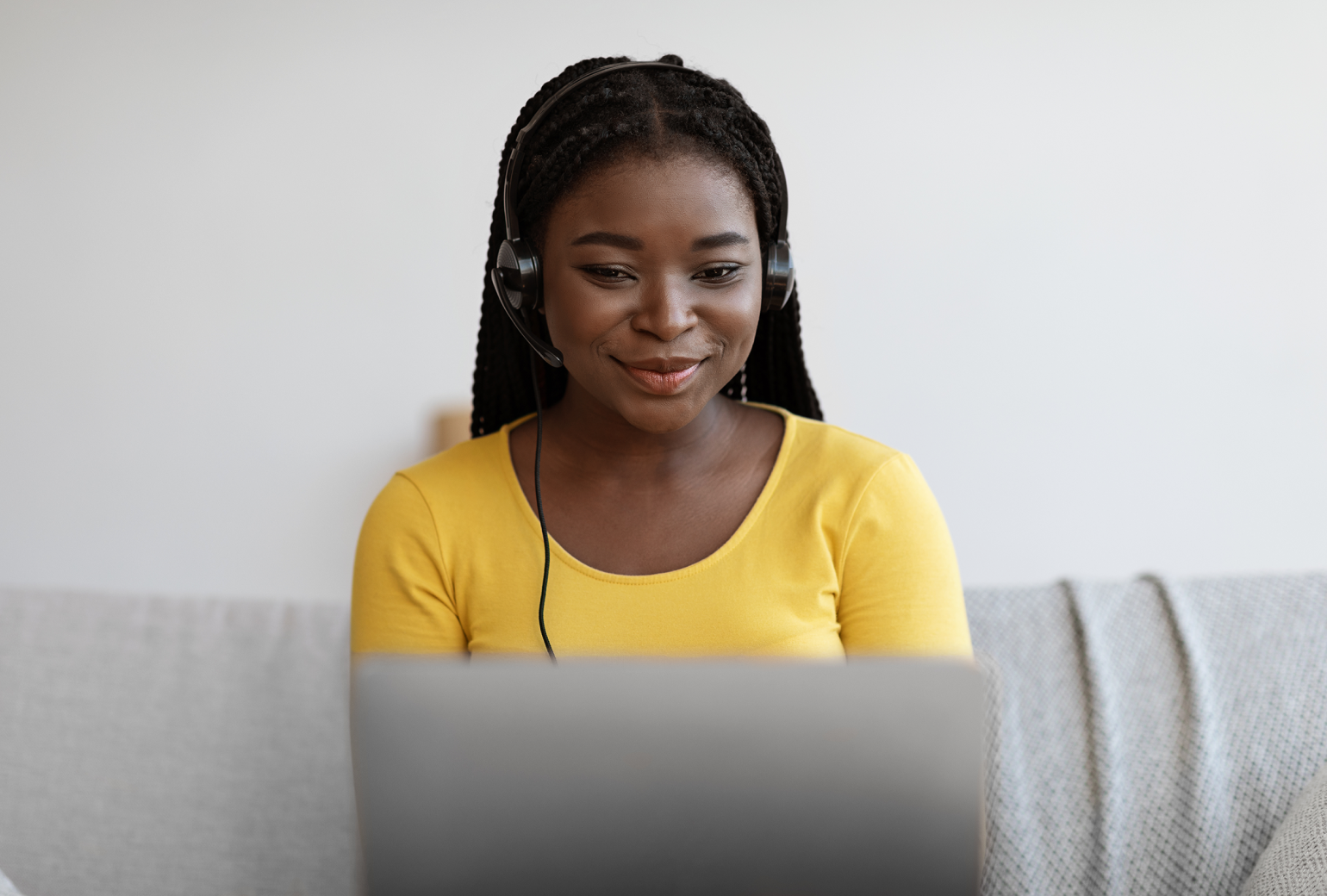 Smiling customer service rep wearing a phone headset