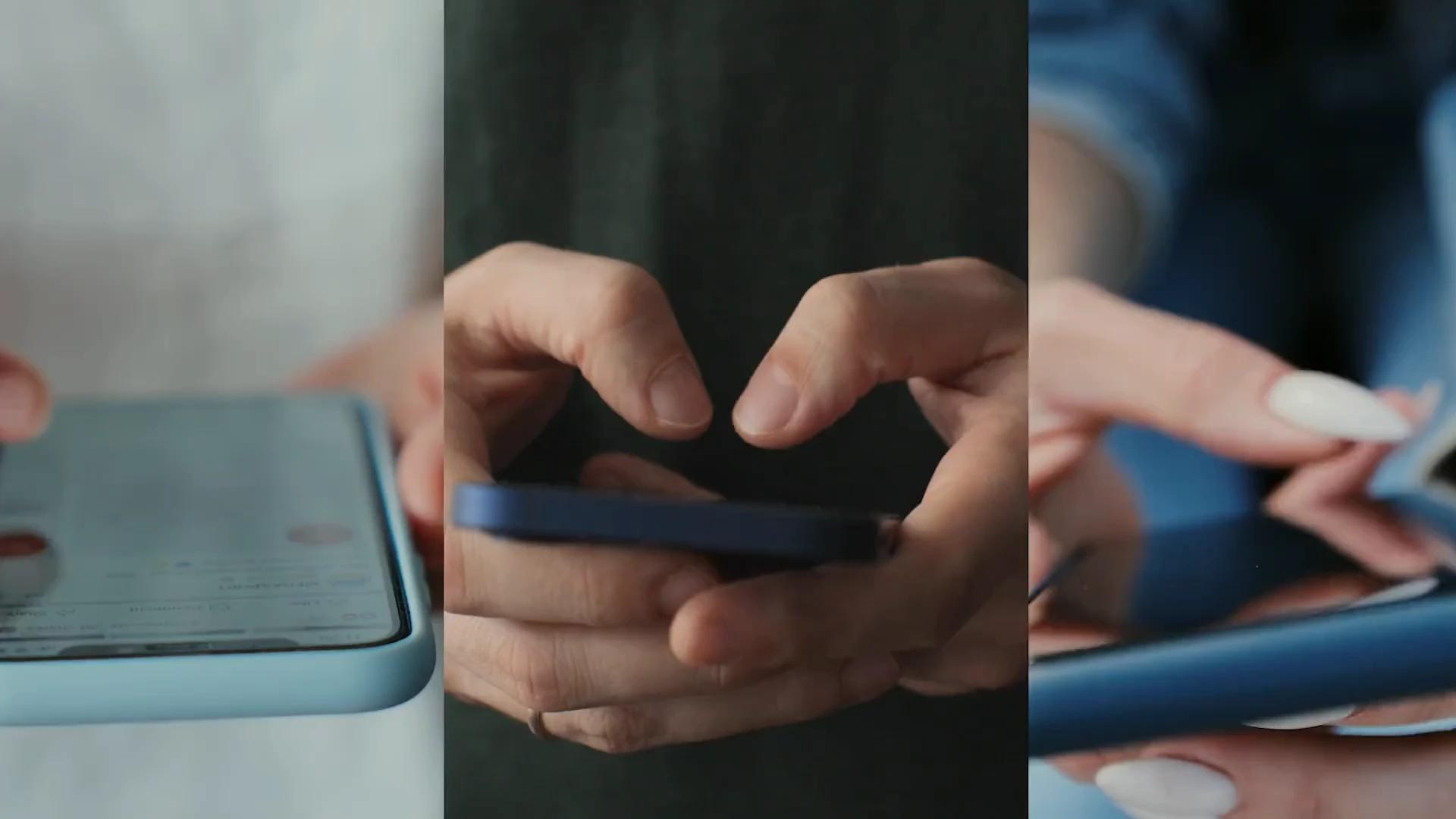 Close-up of hands holding and tapping phones