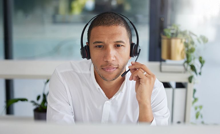 Man talking on a phone headset