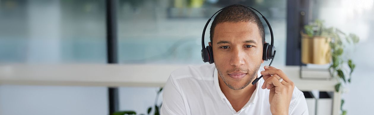 Man talking on a phone headset