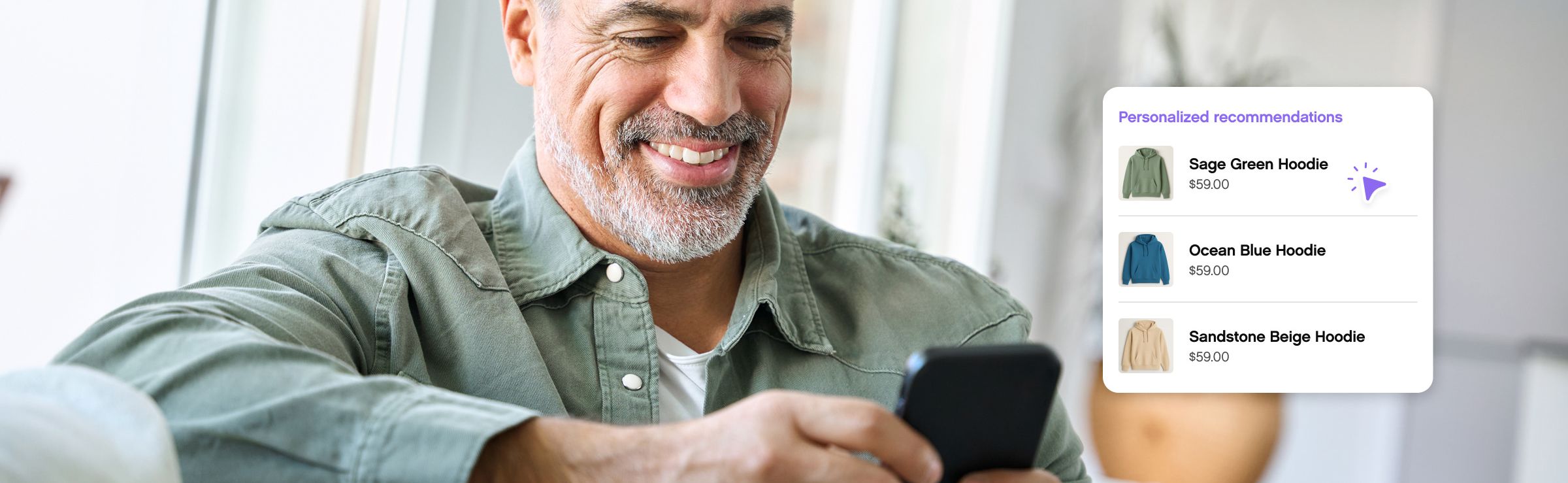 Man sitting down looking at phone smiling