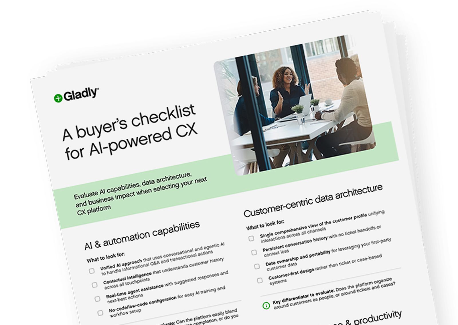 A diverse group of three people sits at a modern office table, engaged in a lively discussion. Laptops and small plants are on the table, creating a collaborative and energetic atmosphere.