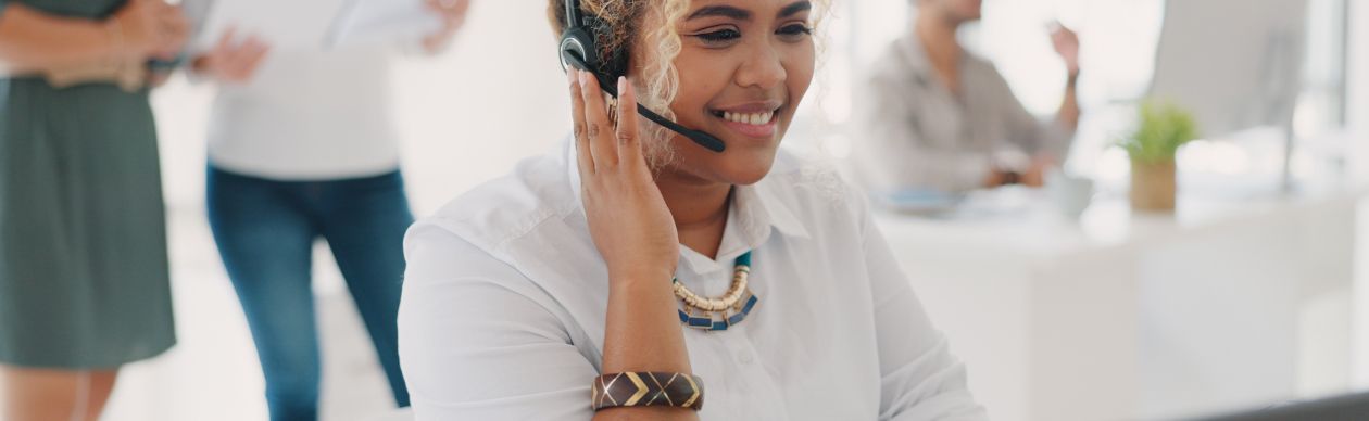 Woman with a phone headset smiling