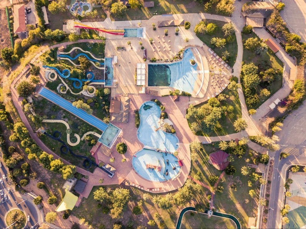 A bird's-eye view of a pool with water slides
