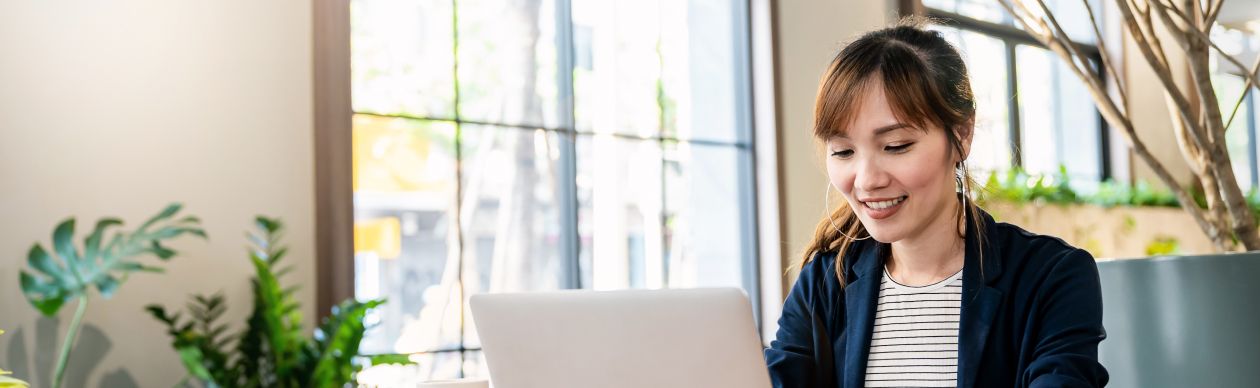 Woman working on a laptop in an office