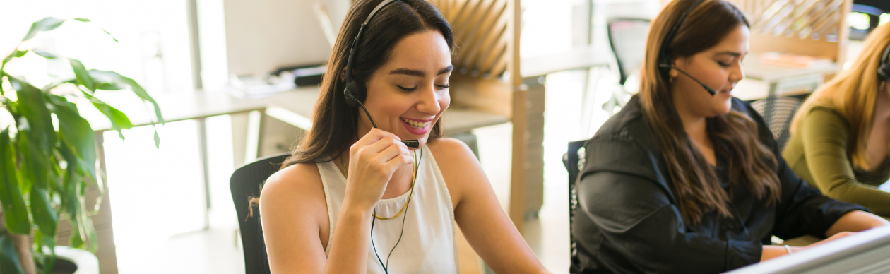 Customer service agents doing their jobs in an office
