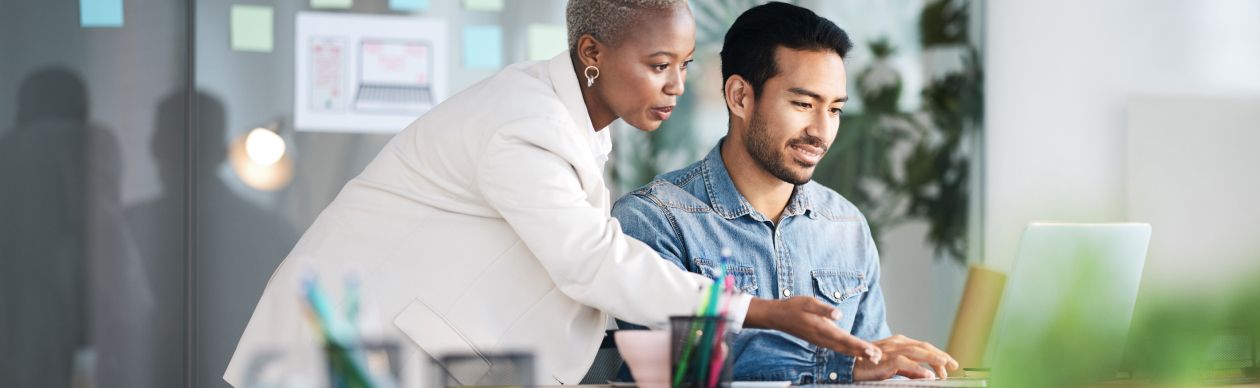 CX experts implementing AI for business at the computer