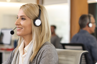 Woman with a phone headset in a call center