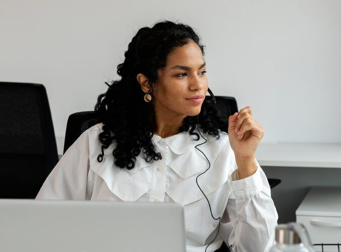 Woman thinking at her desk