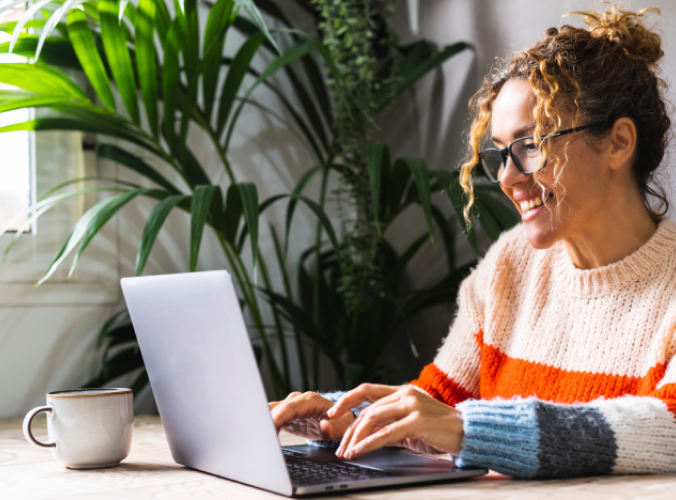 woman smiling at computer