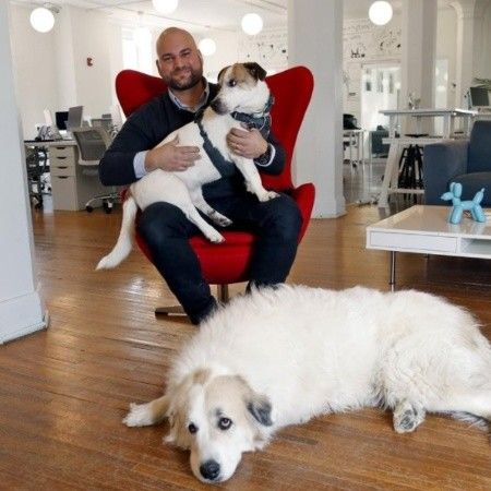 Hernan Giraldo with two dogs