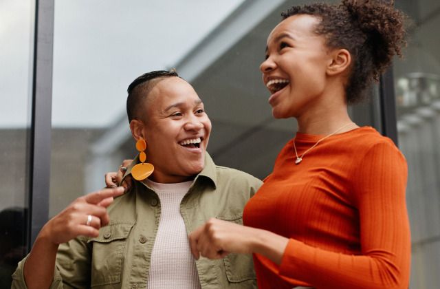 Two women laughing together