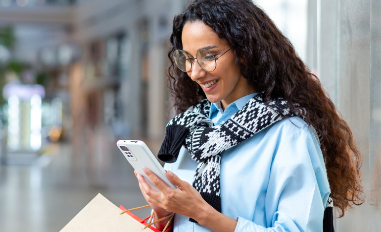 Woman in shopping center checking phone