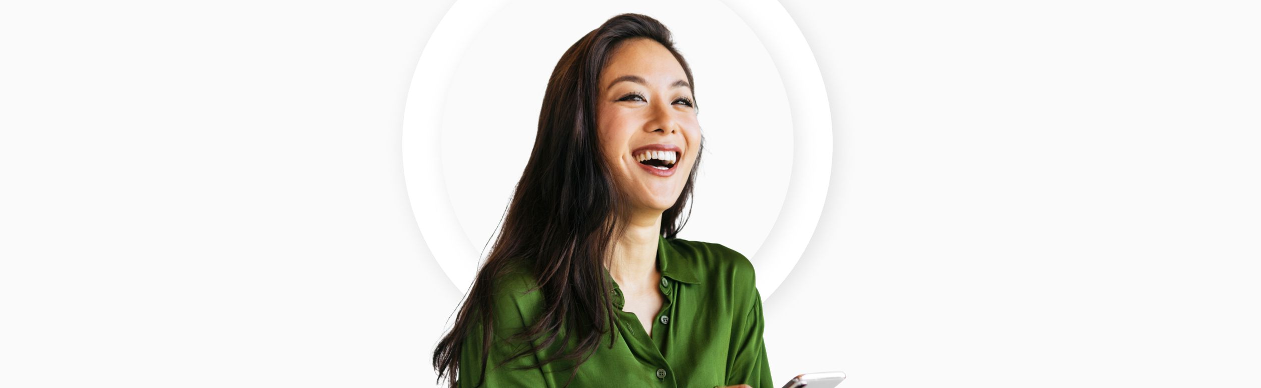 A smiling woman in a green blouse