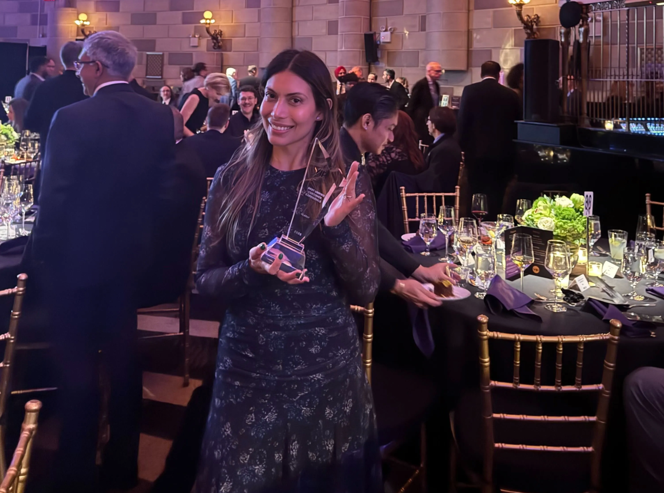 Gladly team member holding the trophy