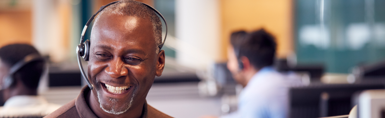 male customer service agent laughing