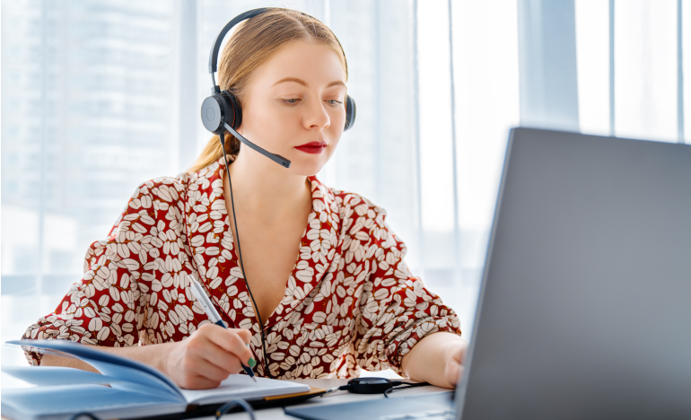Female Customer Service Agent in front of a laptop