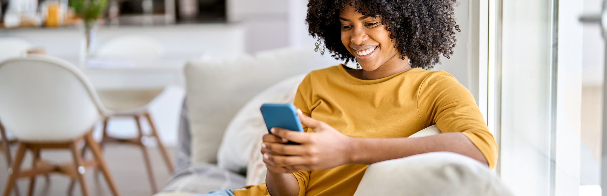 Customer looking at her phone while receiving customer support
