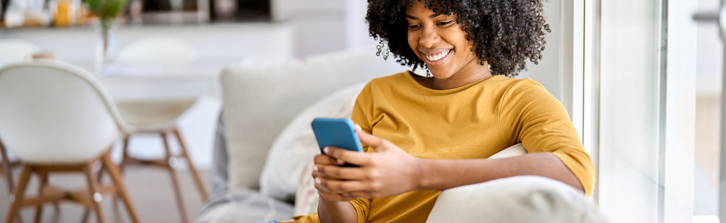 Customer looking at her phone while receiving customer support