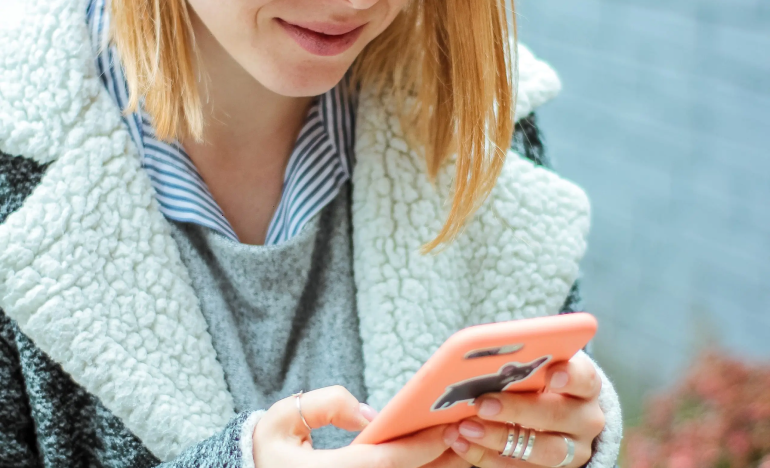 A woman texting on her phone