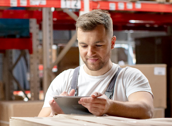 Man using tablet in warehouse