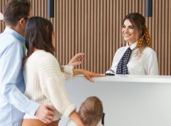 hospitality worker greeting guests