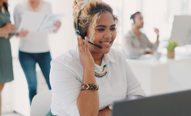 Woman with a phone headset smiling