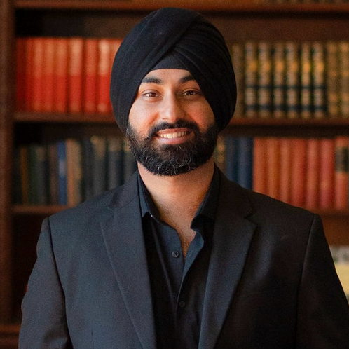 Hans smiling in the photo