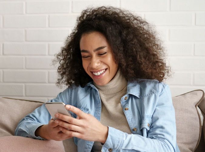 Smiling woman on cellphone