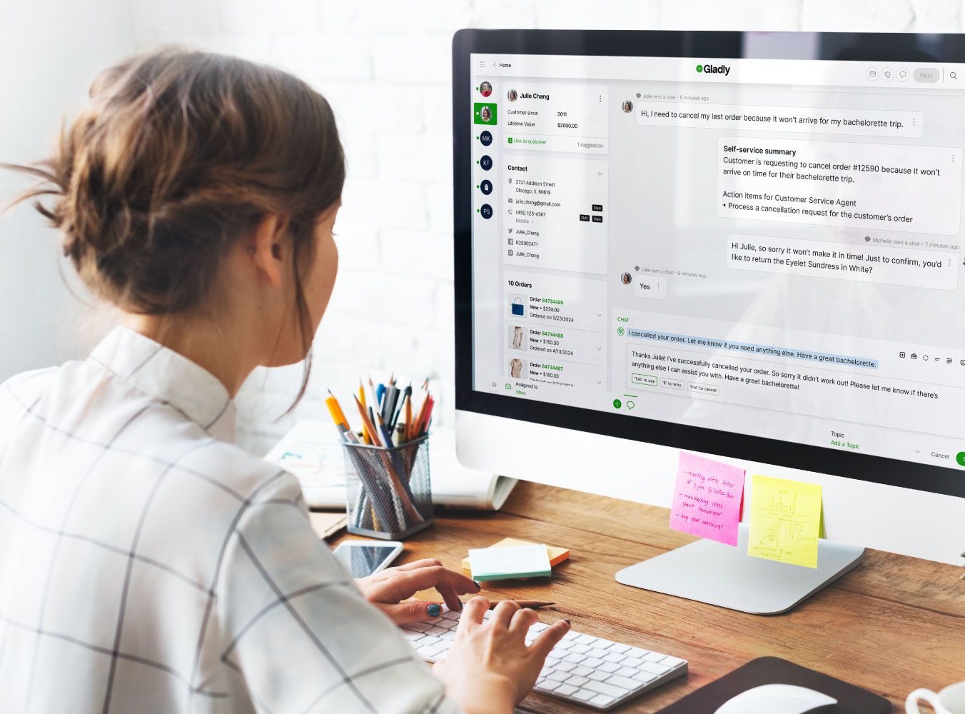 Woman working on a desktop in the Gladly app