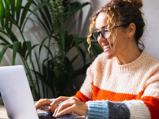 woman smiling at computer