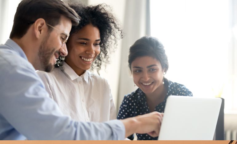 A group of CX practitioners testing AI on their laptop