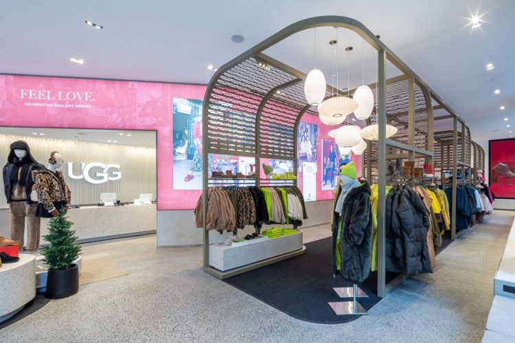 Image of jackets hanging in a display inside a shopping area