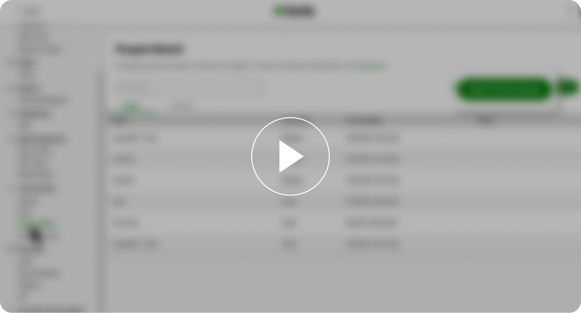 A blurred screenshot of a webpage with a play button overlay. Features a sidebar menu on the left and a central table with text and a green button.