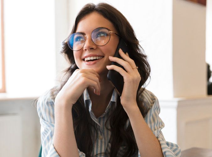 Woman smiling on telephone