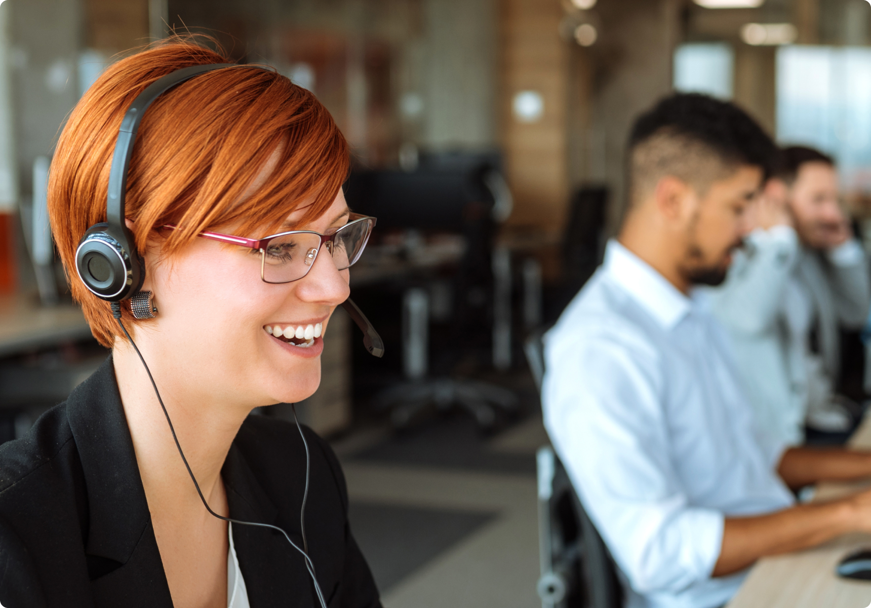 Woman smiling while talking on a headset