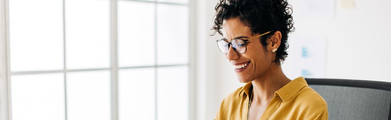 A customer on their computer feeling safe because the company they're using has SOC 2 Type II compliance