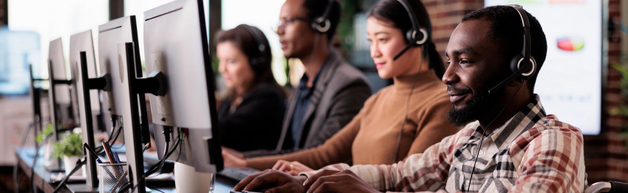 A row of customer service representatives at work