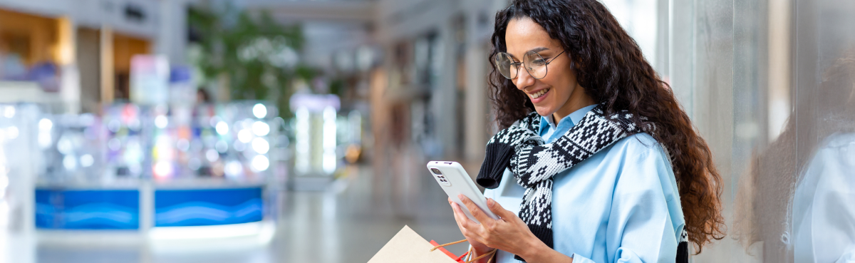 Woman in shopping center checking phone
