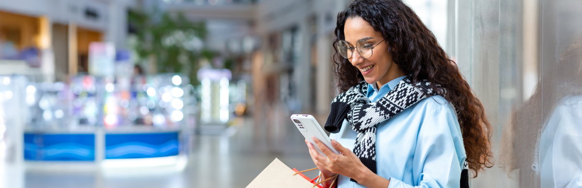 Woman in shopping center checking phone