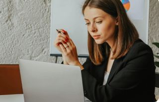 Business woman looking at a laptop