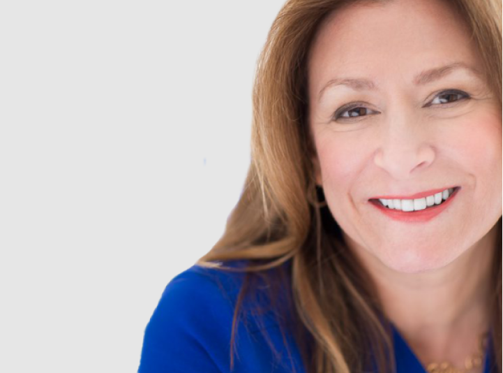 Image of a woman smiling looking into a camera