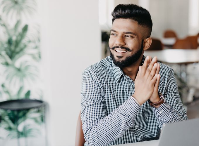 Man sitting in an office. Natural language processing image.