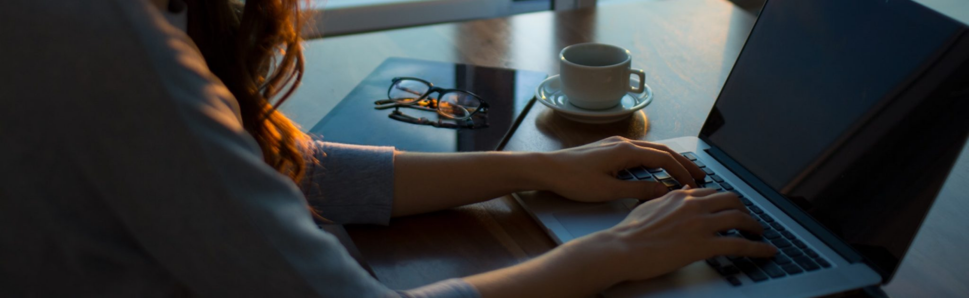 Woman typing on a laptop