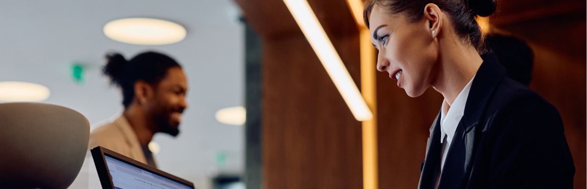 woman working at a hotel desk